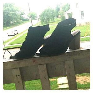 Time and thru black wood heels.